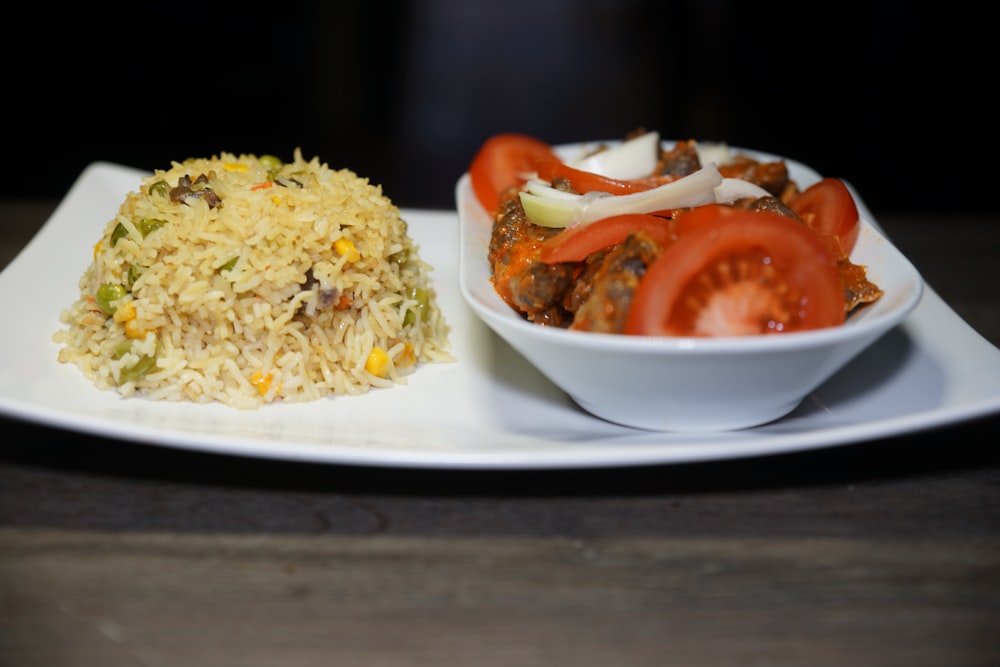 rice with tomato and egg on white ceramic plate