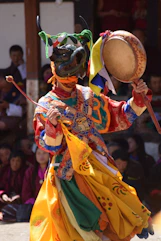 man in red and yellow traditional dress