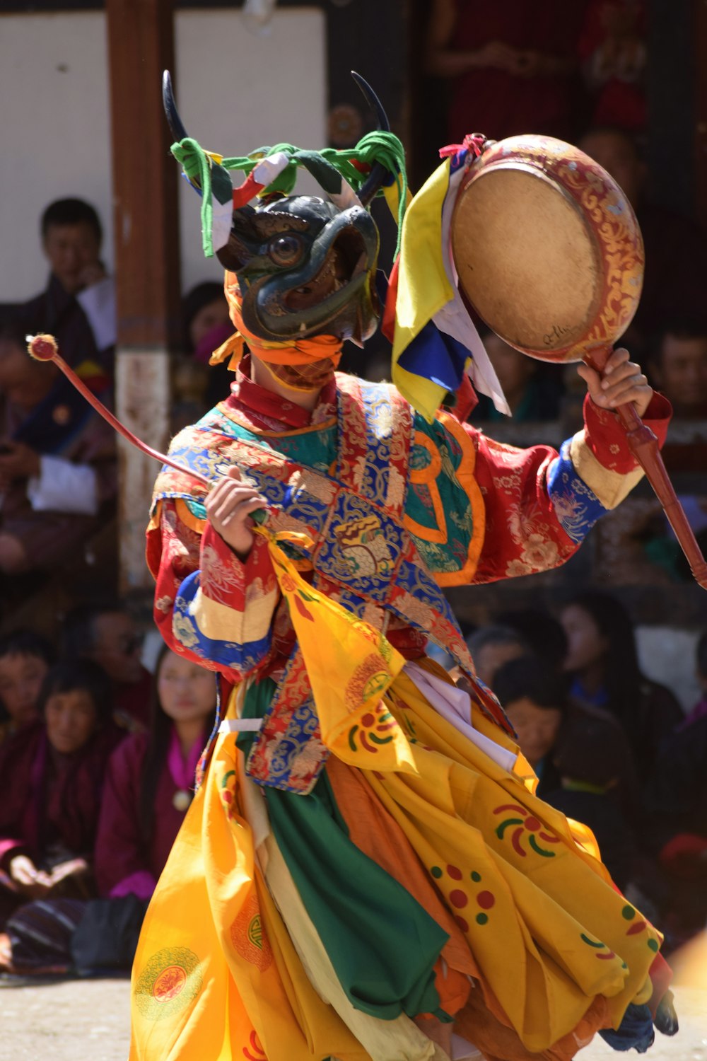 man in red and yellow traditional dress