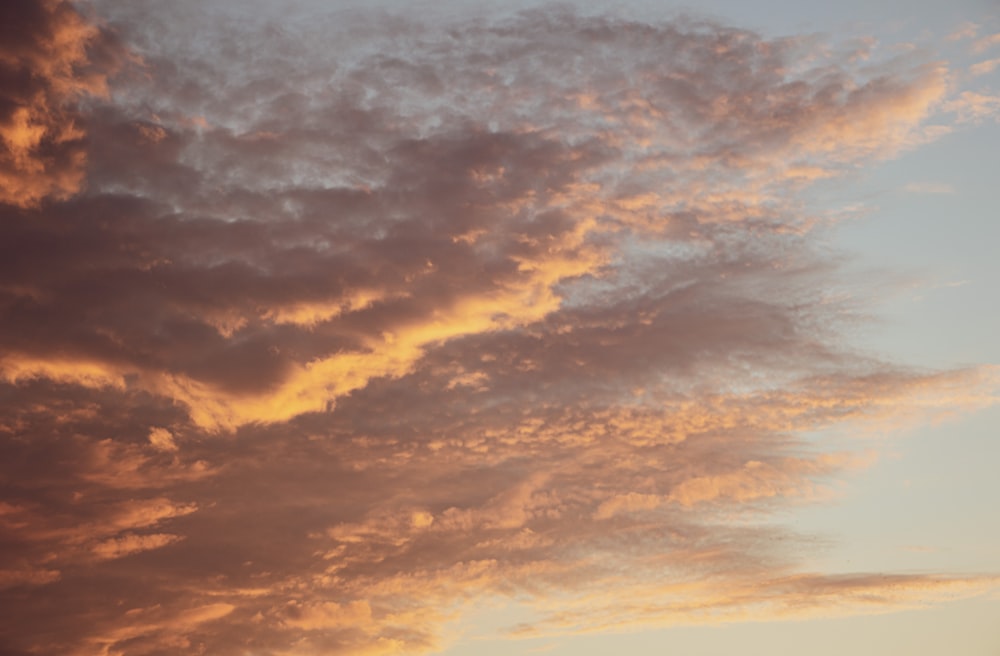 orange and grey clouds during sunset