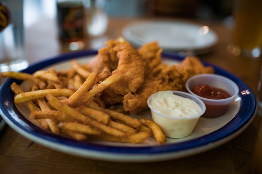 fried fries on blue ceramic bowl