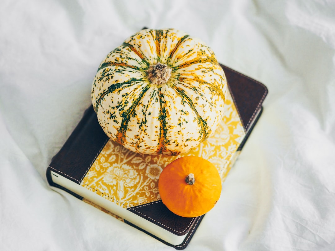 yellow and green pumpkin on black tablet computer