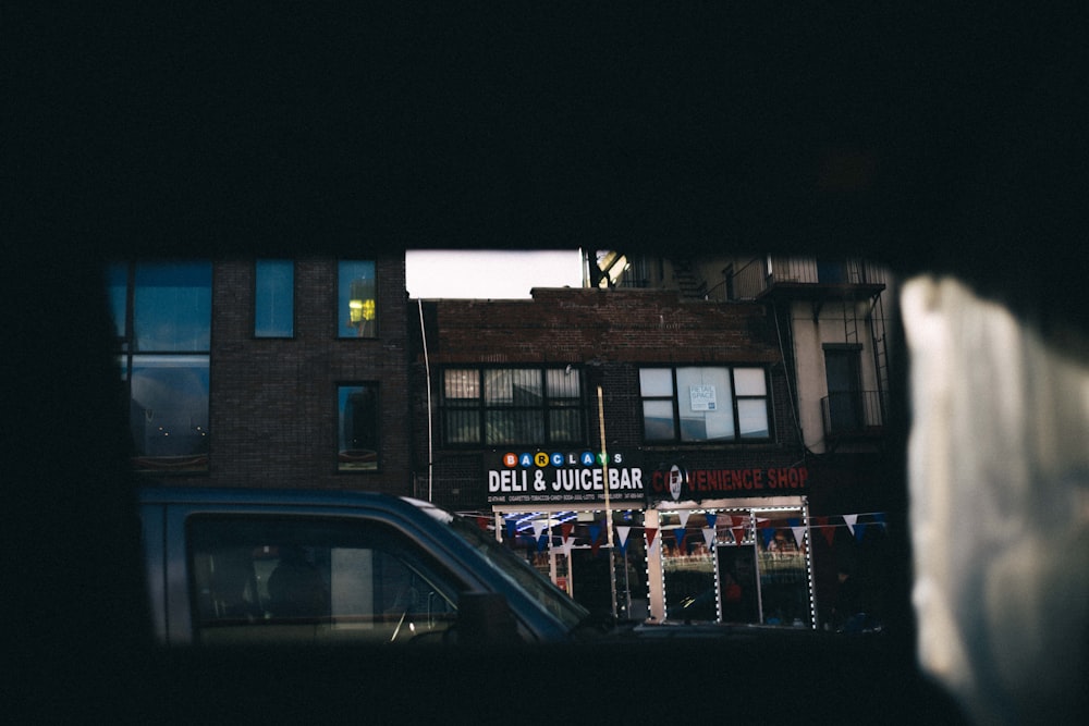 cars parked in front of building during night time