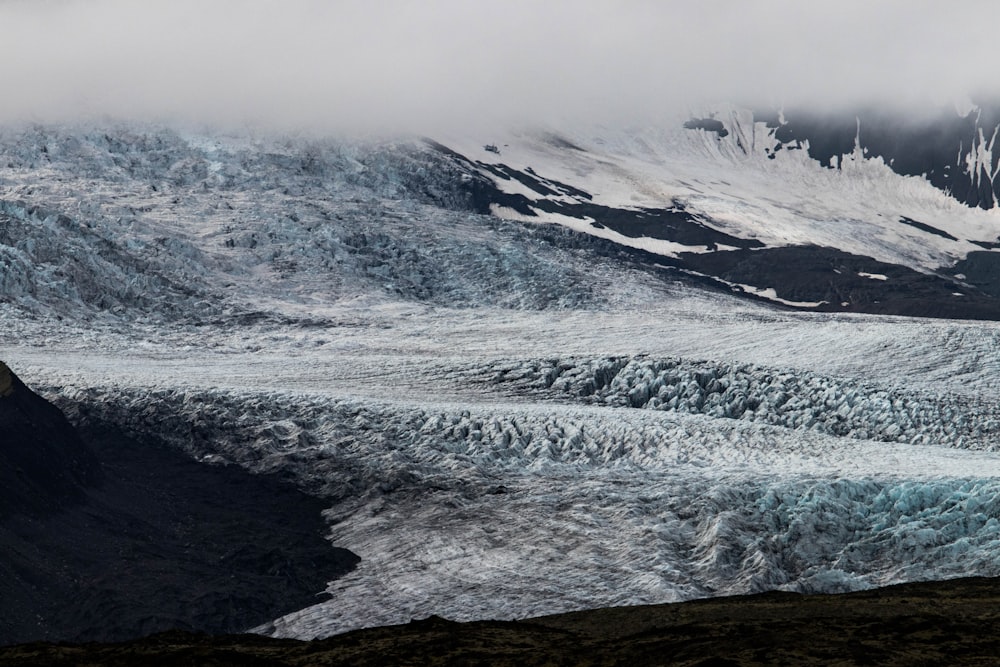 snow covered mountain during daytime