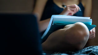 person holding blue and white plastic bottle