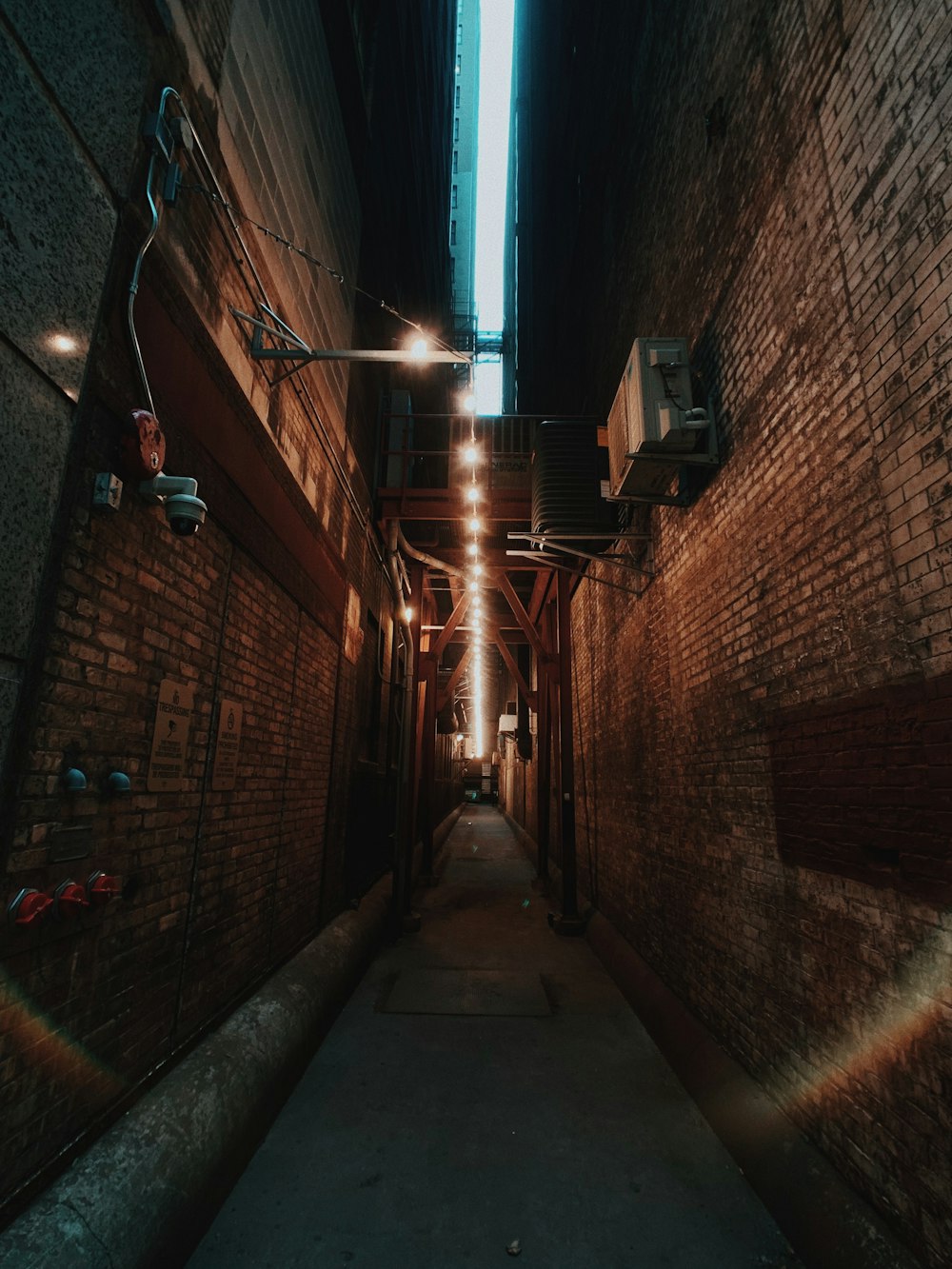 brown brick wall with light fixture