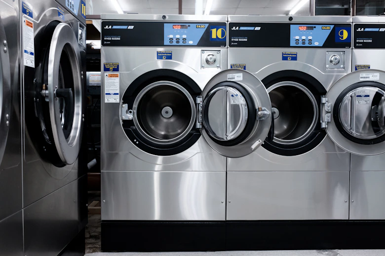 Premium stacked laundry appliances in a modern home