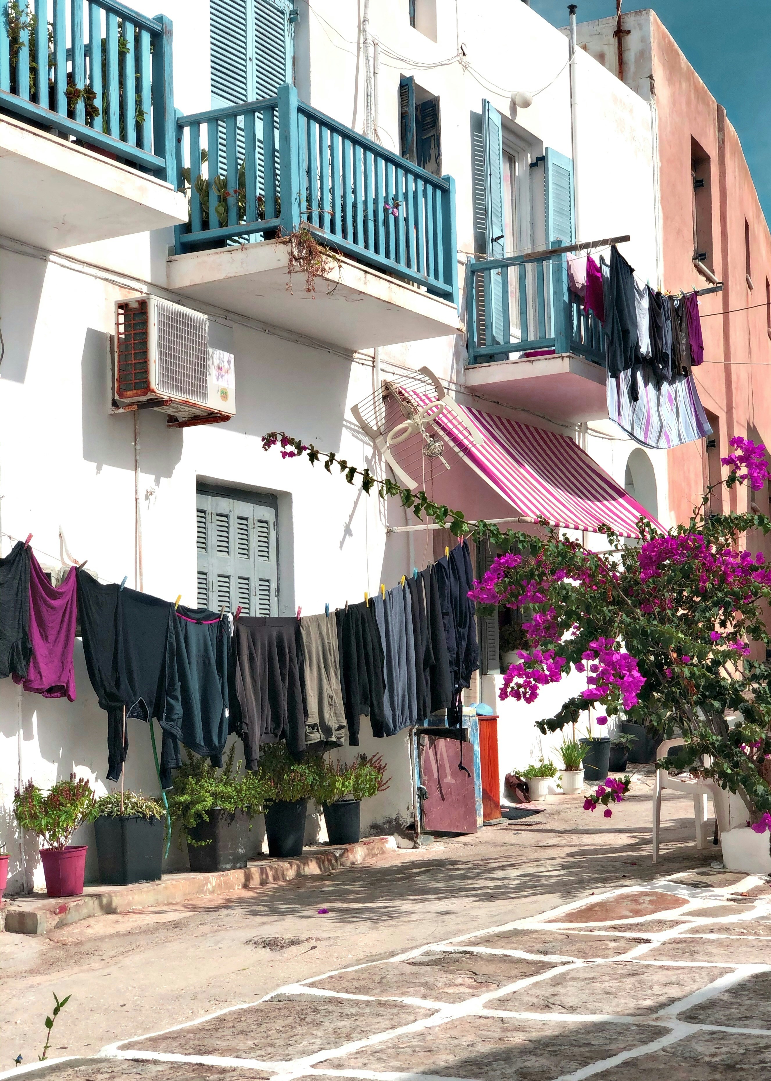 clothes hanged on clothes line on the street
