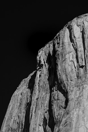 grayscale photo of rocky mountain