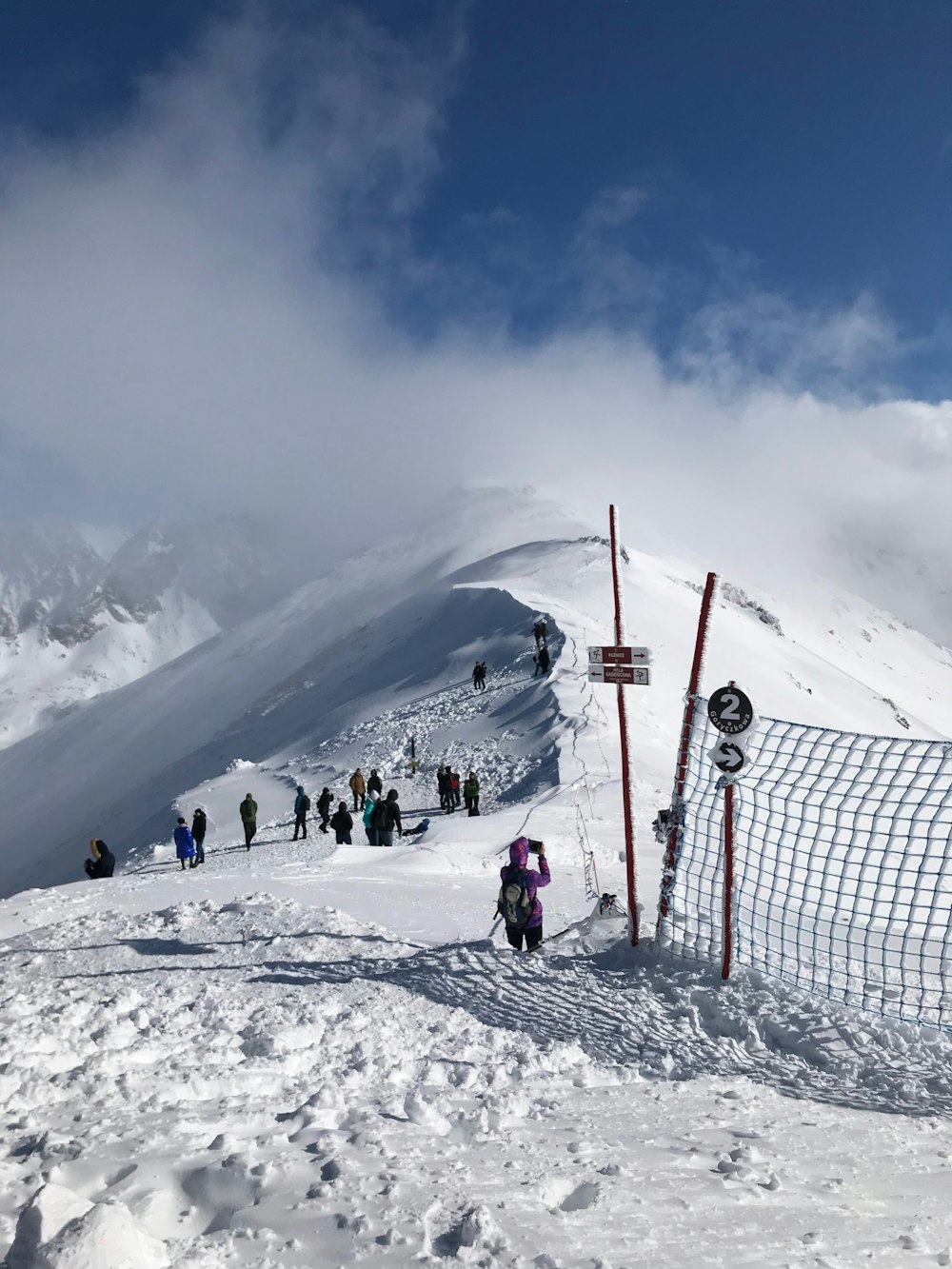 people on snow covered mountain during daytime