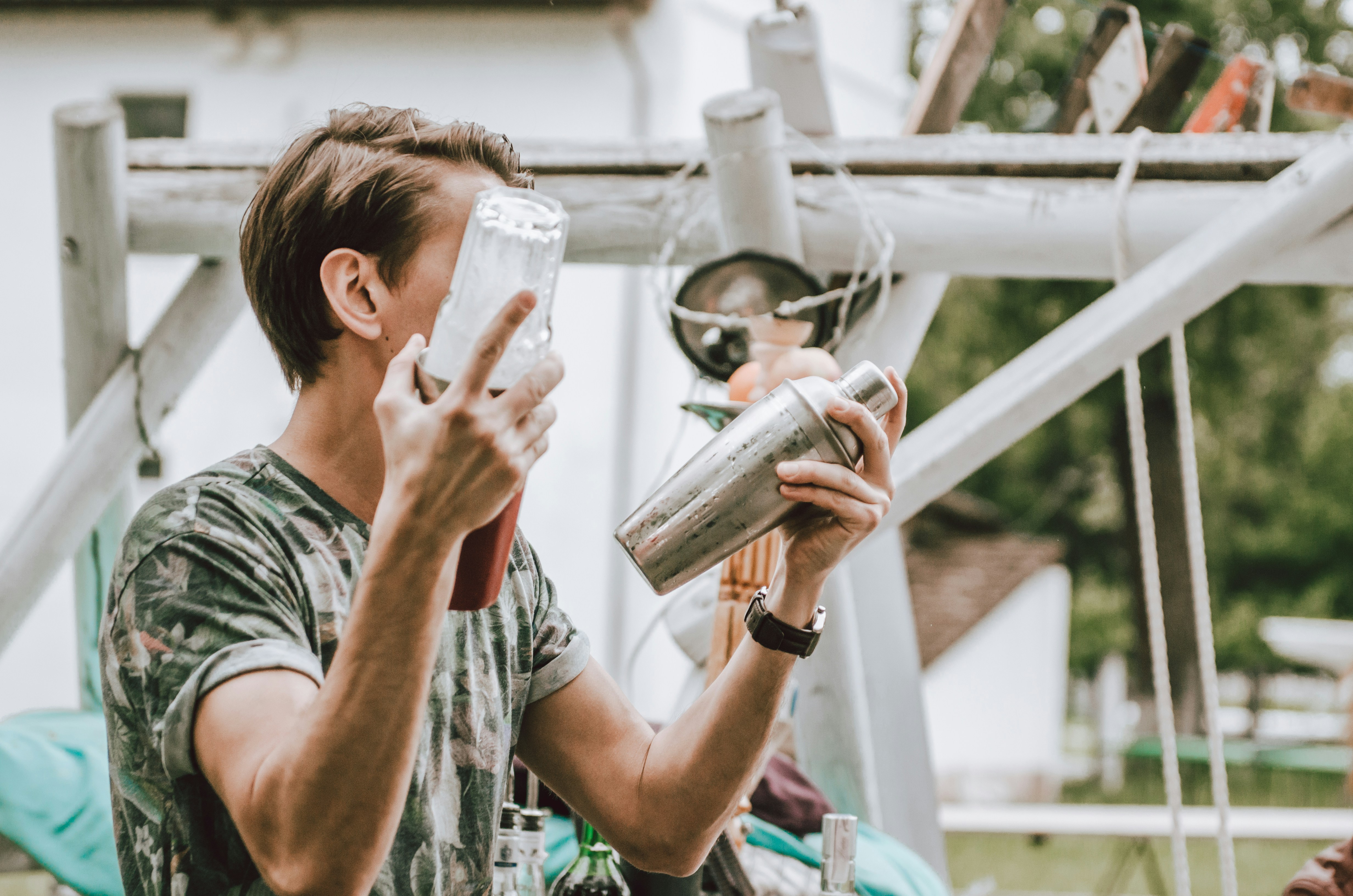 bartender shaking drinks on a patio