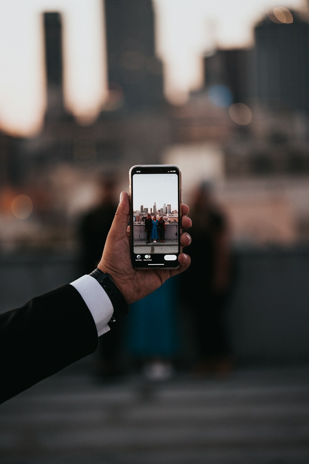 person holding silver iphone 6