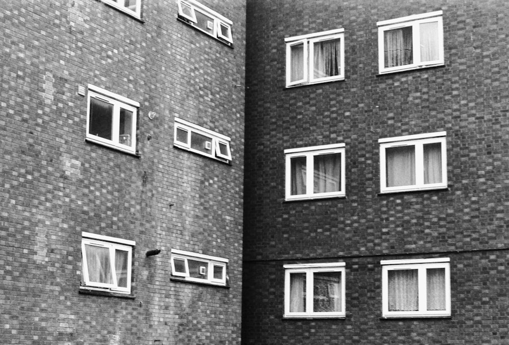 grayscale photo of brick building