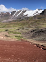 a mountain range with snow on the top of it