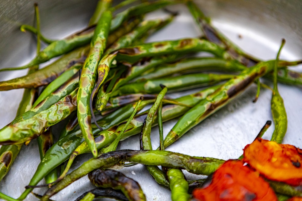 green chili on white textile