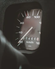 black and white analog speedometer