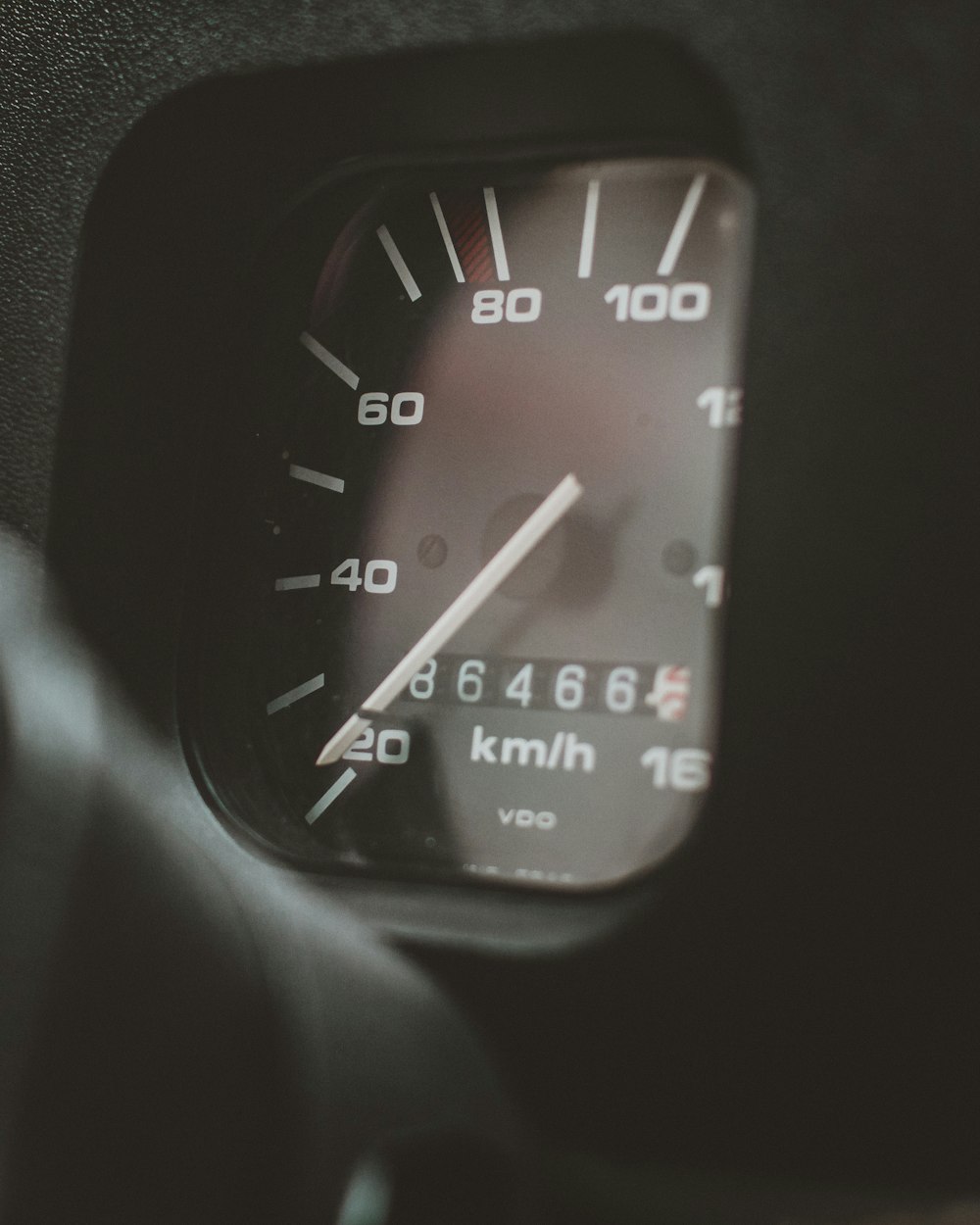 black and white analog speedometer