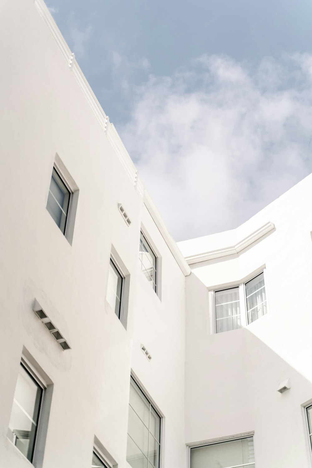 white concrete building under blue sky during daytime