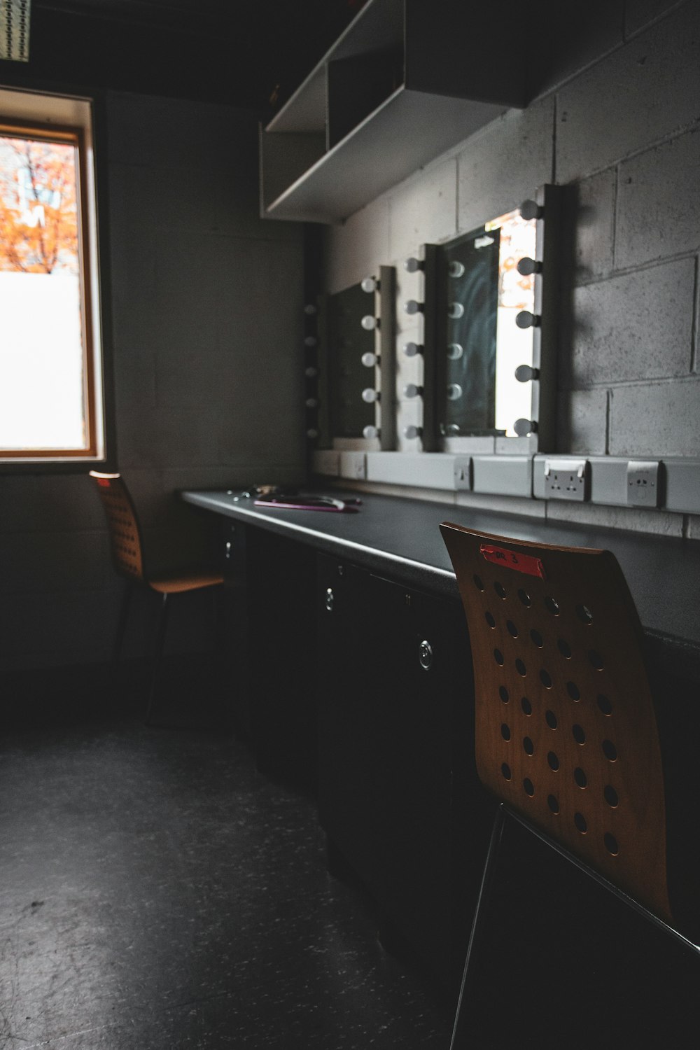 black wooden chair beside white wooden desk