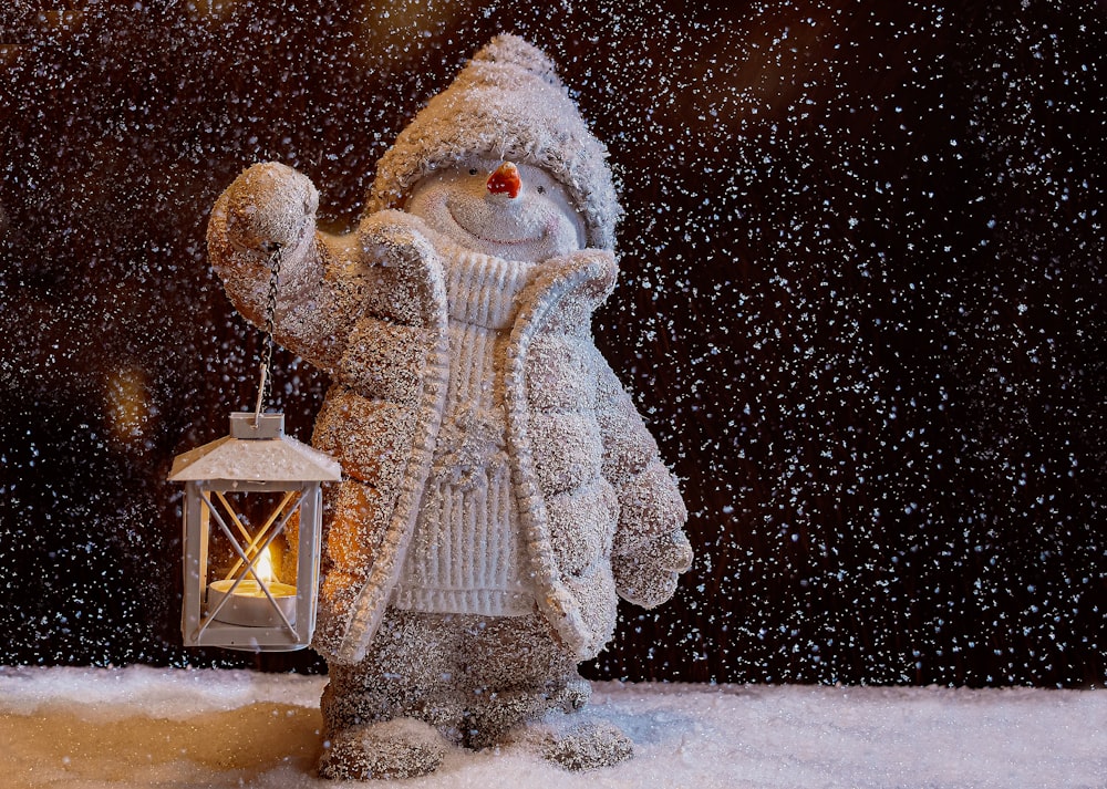 snowman with white scarf and white snowman hat