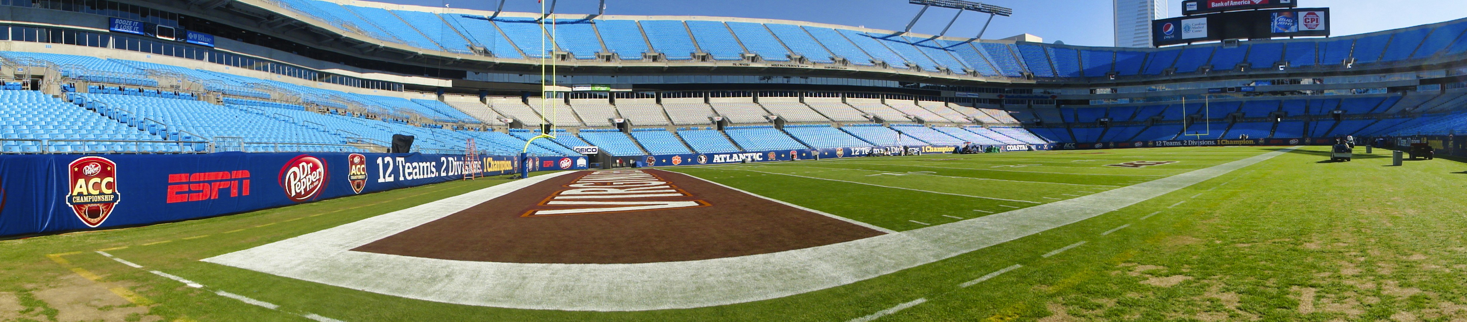 green and brown football field, Bank of America Stadium in stadium is prepped for the ACC Football Championship game.