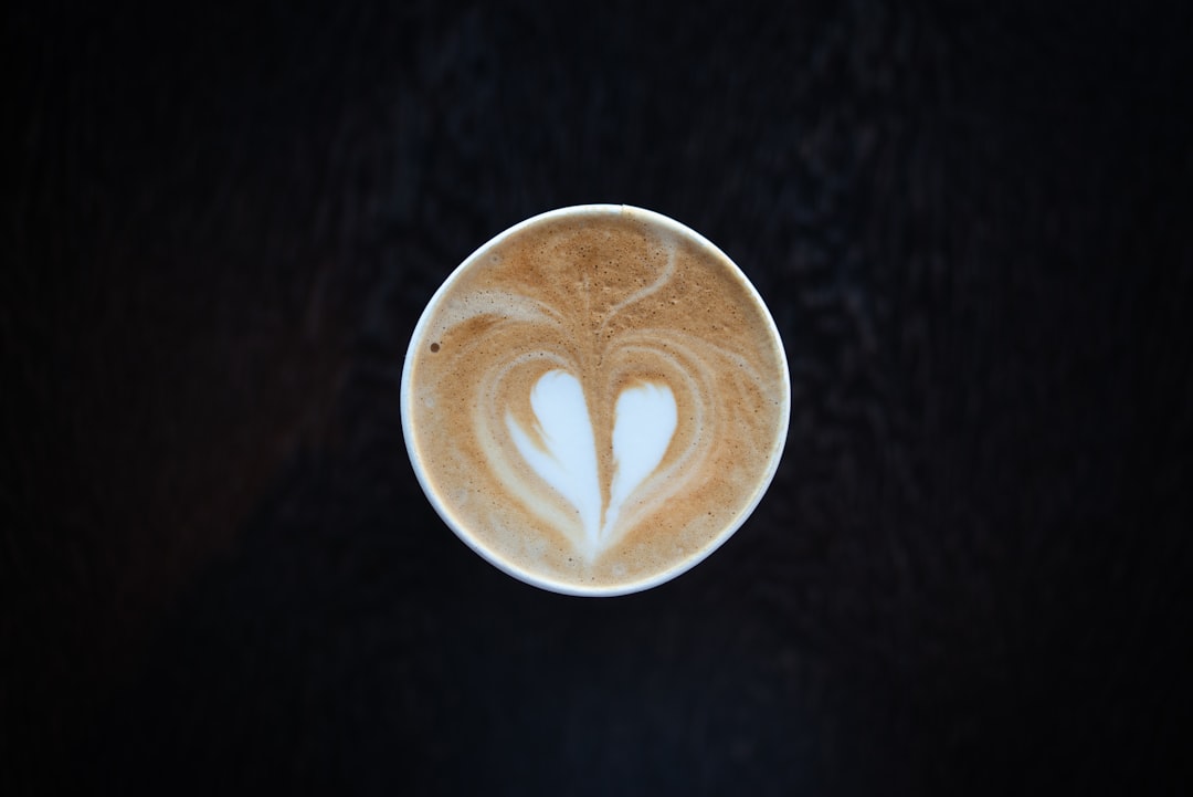 white ceramic mug with heart design