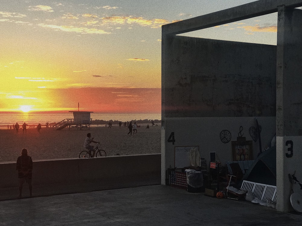 people on beach during sunset