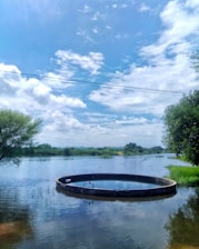 Clean and well-maintained septic tank system with clear surroundings under a bright sky.