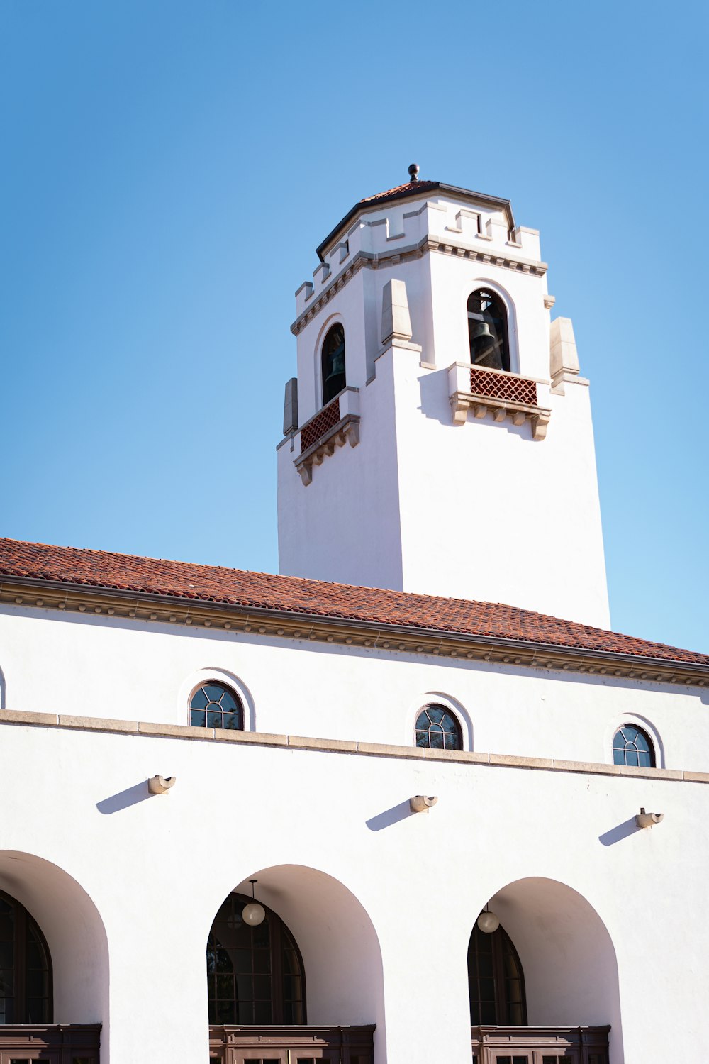 white and brown concrete building under blue sky during daytime