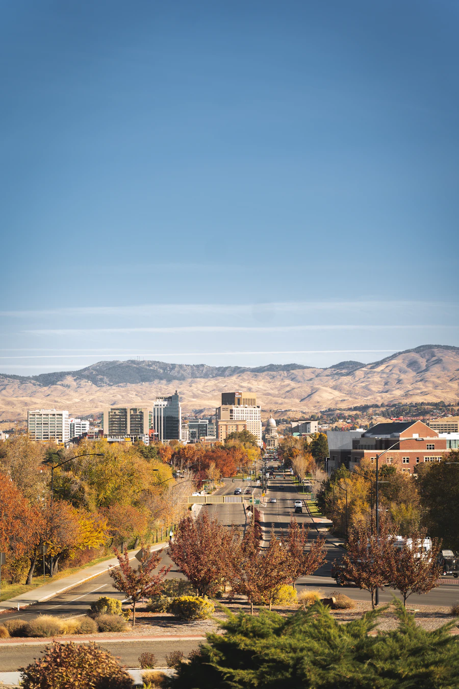Downtown Boise seen from above with the Boise Foothills behind the city