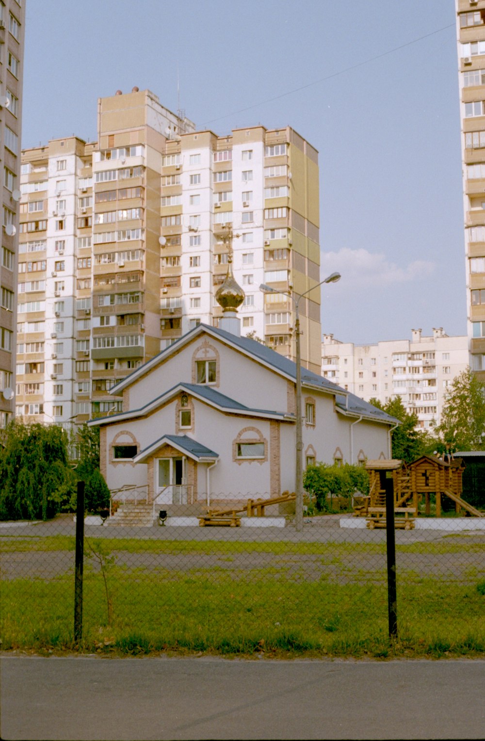 white concrete building near green grass field during daytime