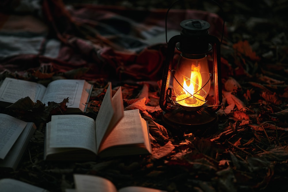 brown and black lantern on brown wooden table