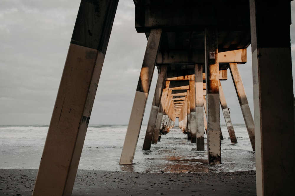 brown wooden dock on sea during daytime