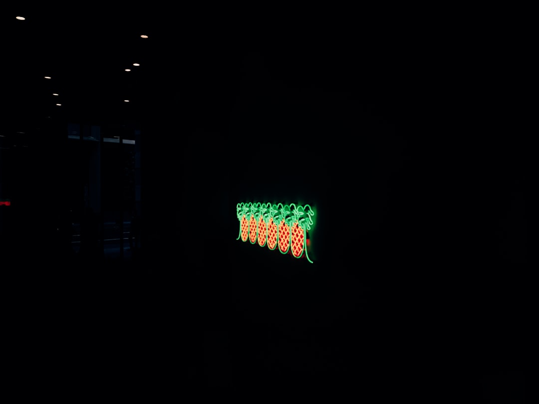 green and white light on dark room