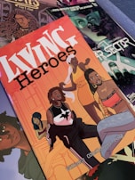A collection of comic book covers is displayed, featuring vibrant illustrations. The prominent cover, 'Living Heroes,' showcases several animated characters, each with distinct styles and expressions, possibly indicating a diverse group of superheroes. The background includes other comic covers with detailed artwork in various colors.