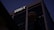 A tall office building under a dark sky, prominently featuring the letters 'BB&T' at the top. The structure is designed with large glass windows and concrete frameworks, creating a modern architectural appearance.