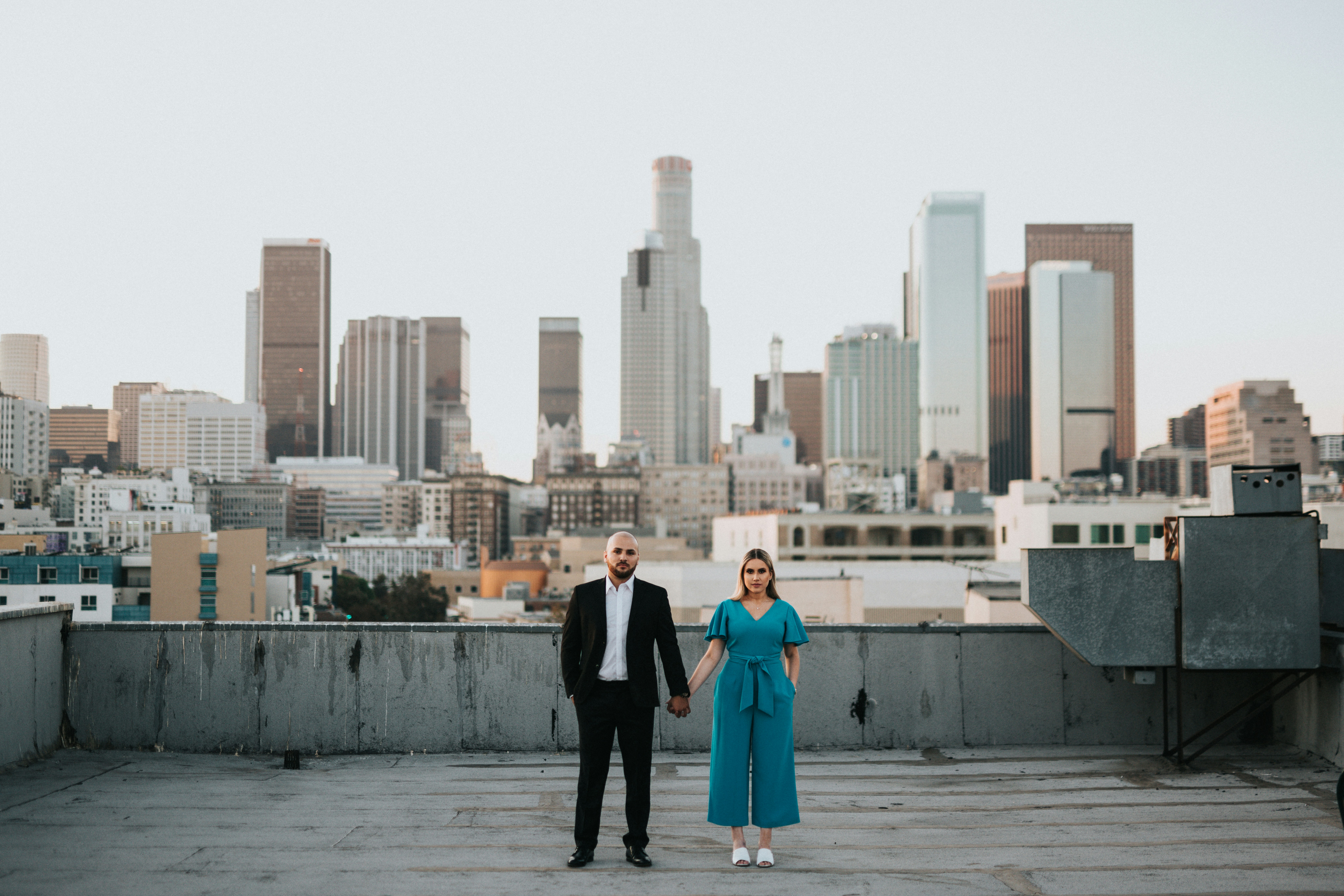 great photo recipe,how to photograph man and woman standing on gray concrete floor during daytime