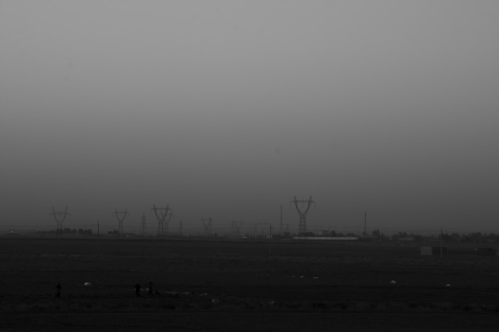 silhouette of wind turbines during daytime