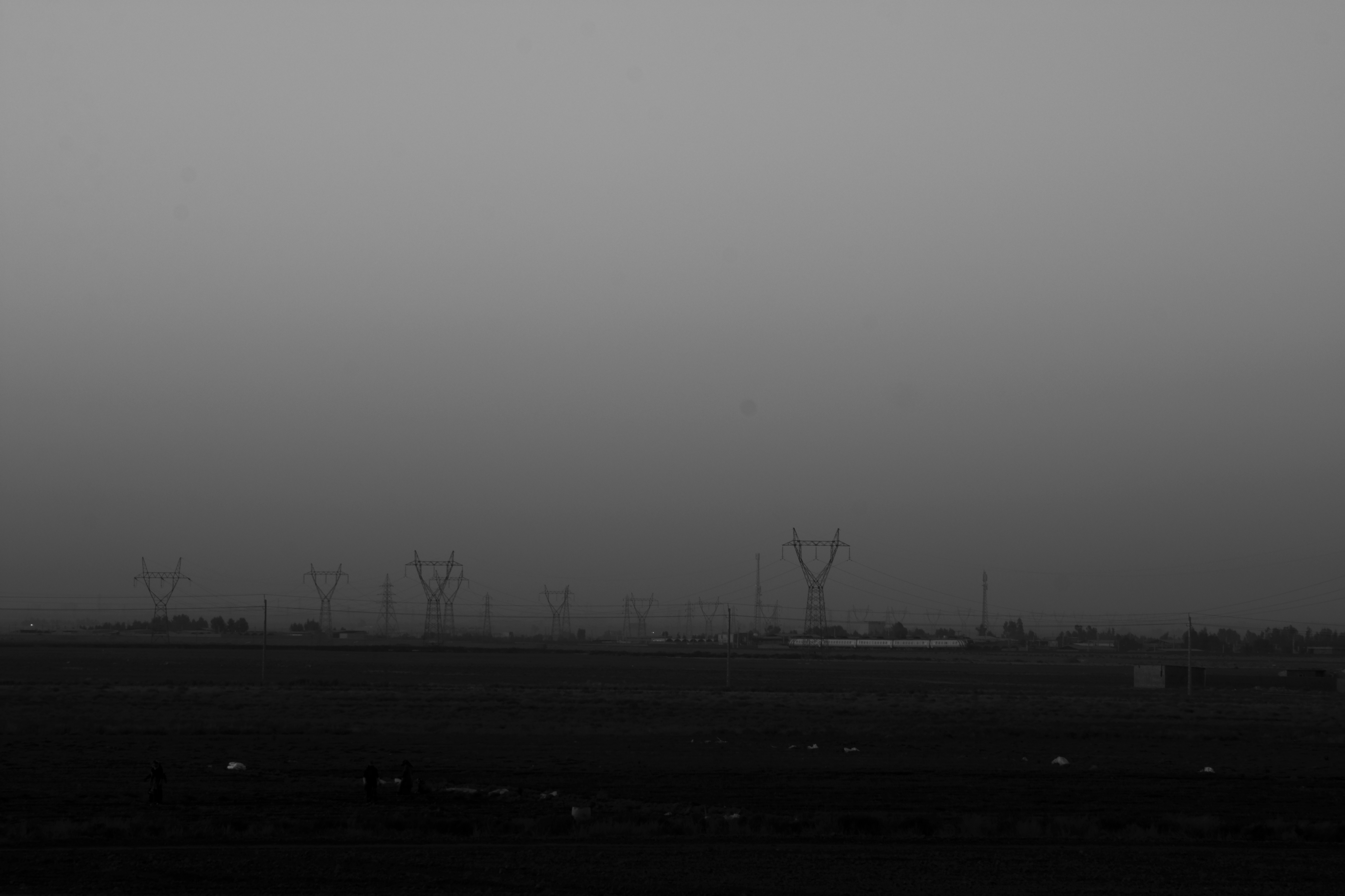 silhouette of wind turbines during daytime