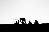 silhouette of people on field during daytime