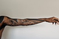 An after image revealing the same arm, now free of tattoos.