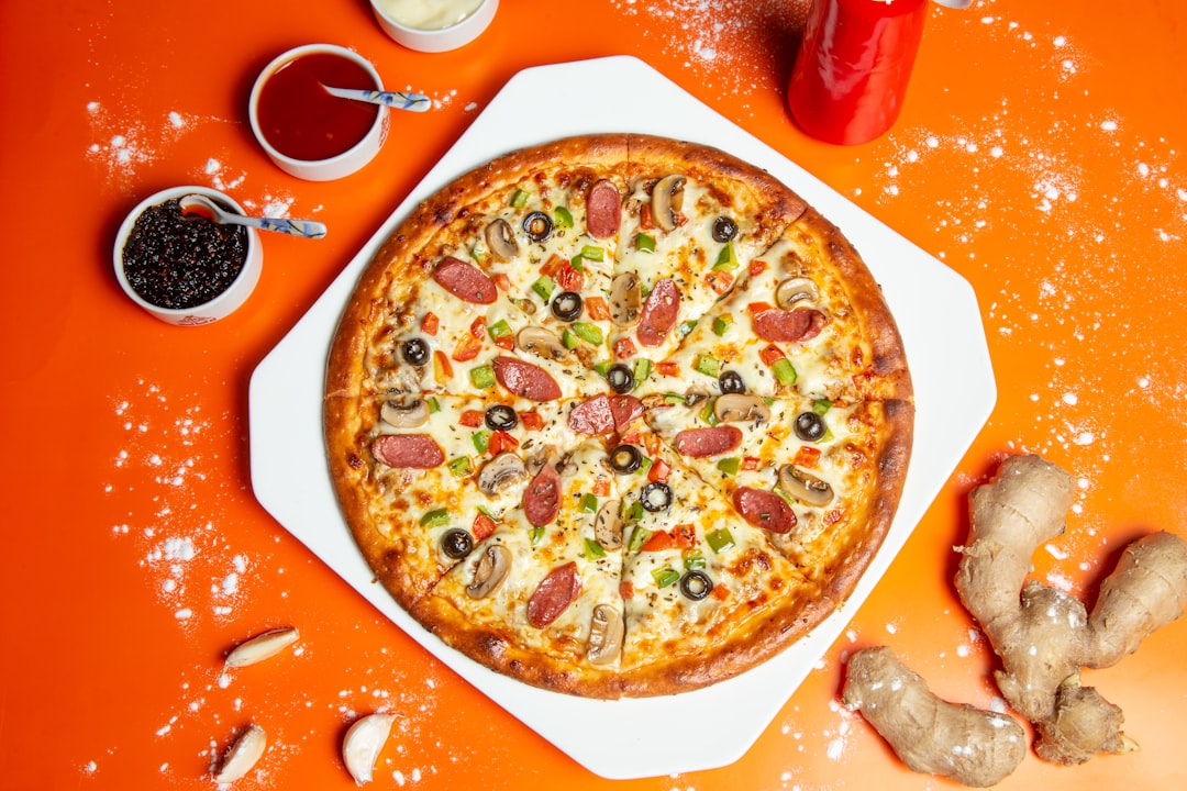 pizza with cheese and green leaf,