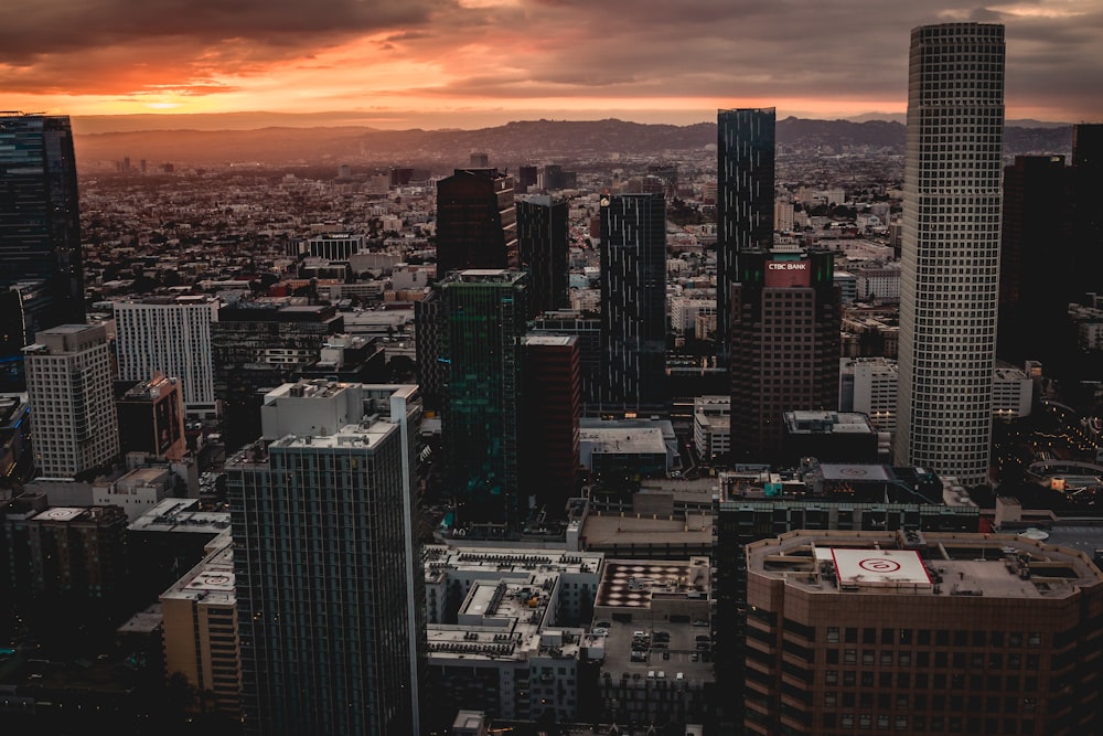 city skyline during sunset with orange sky