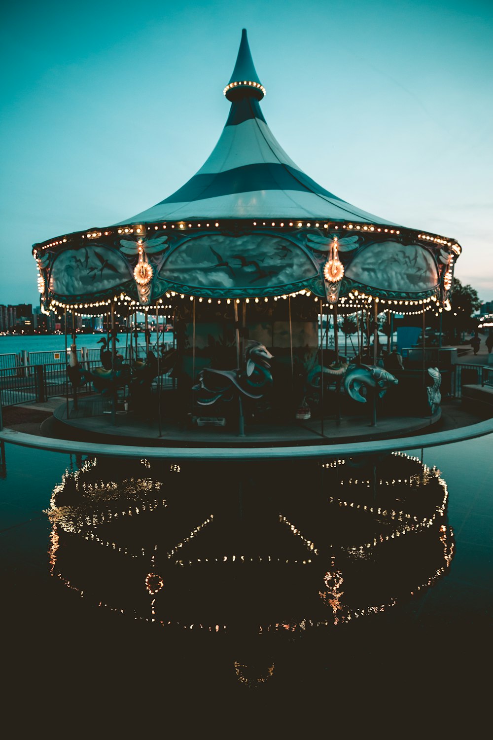 carousel with lights turned on during night time