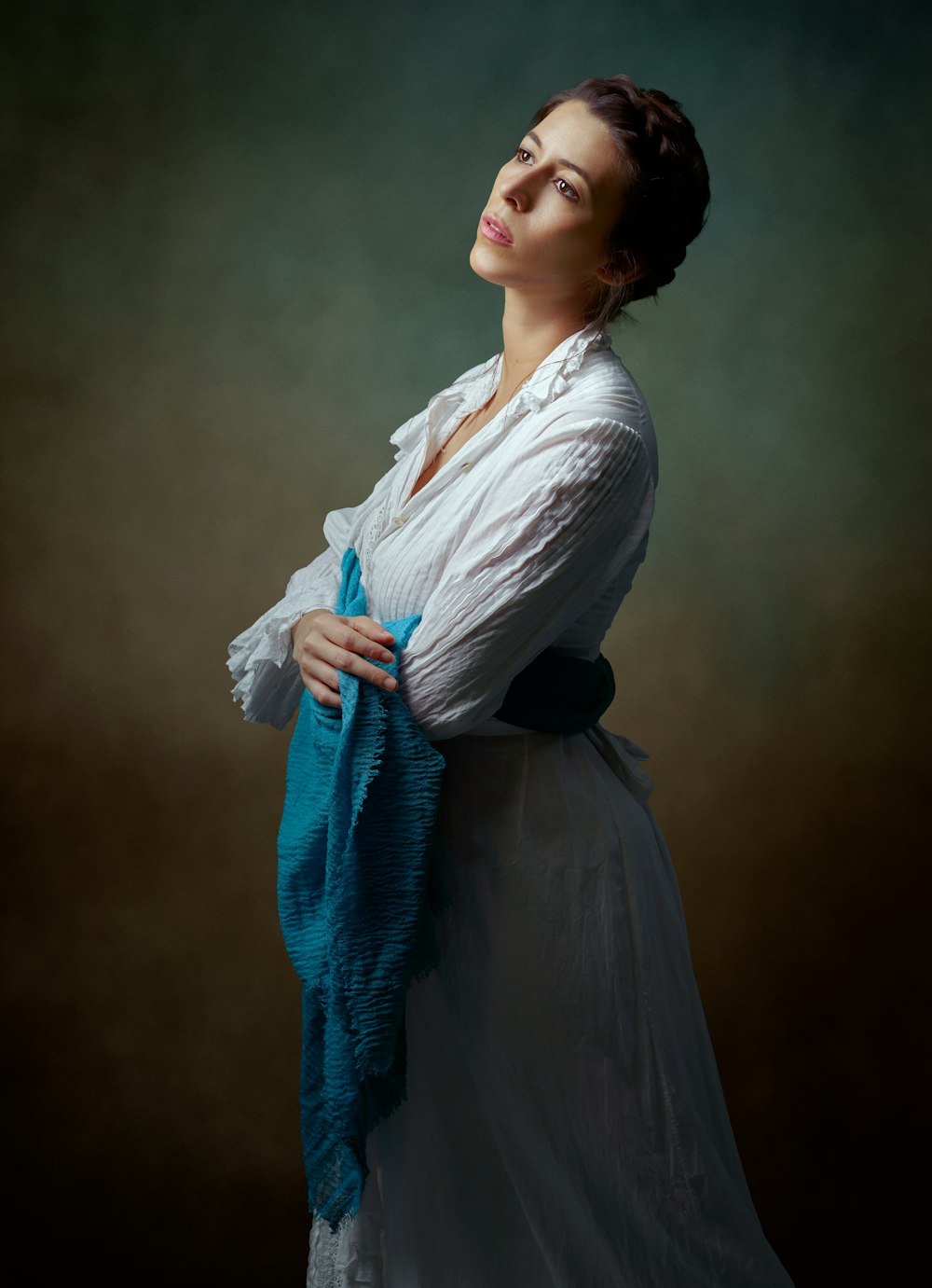 woman in white long sleeve shirt and blue scarf