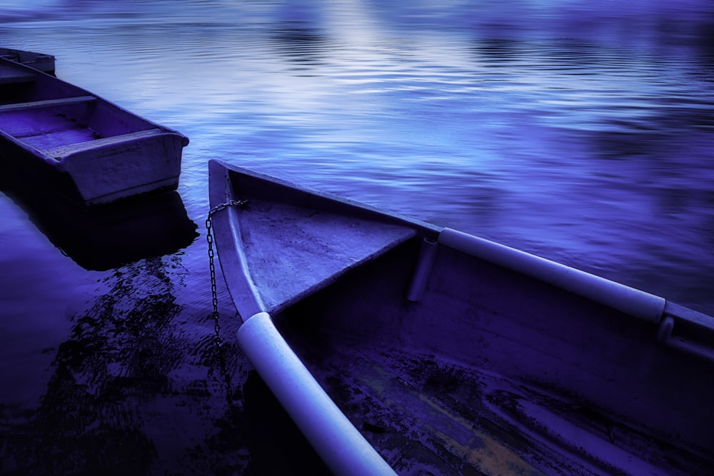 blue boat on body of water during daytime