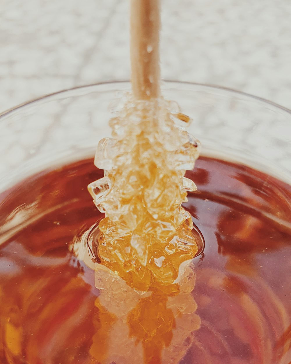 clear drinking glass with brown liquid