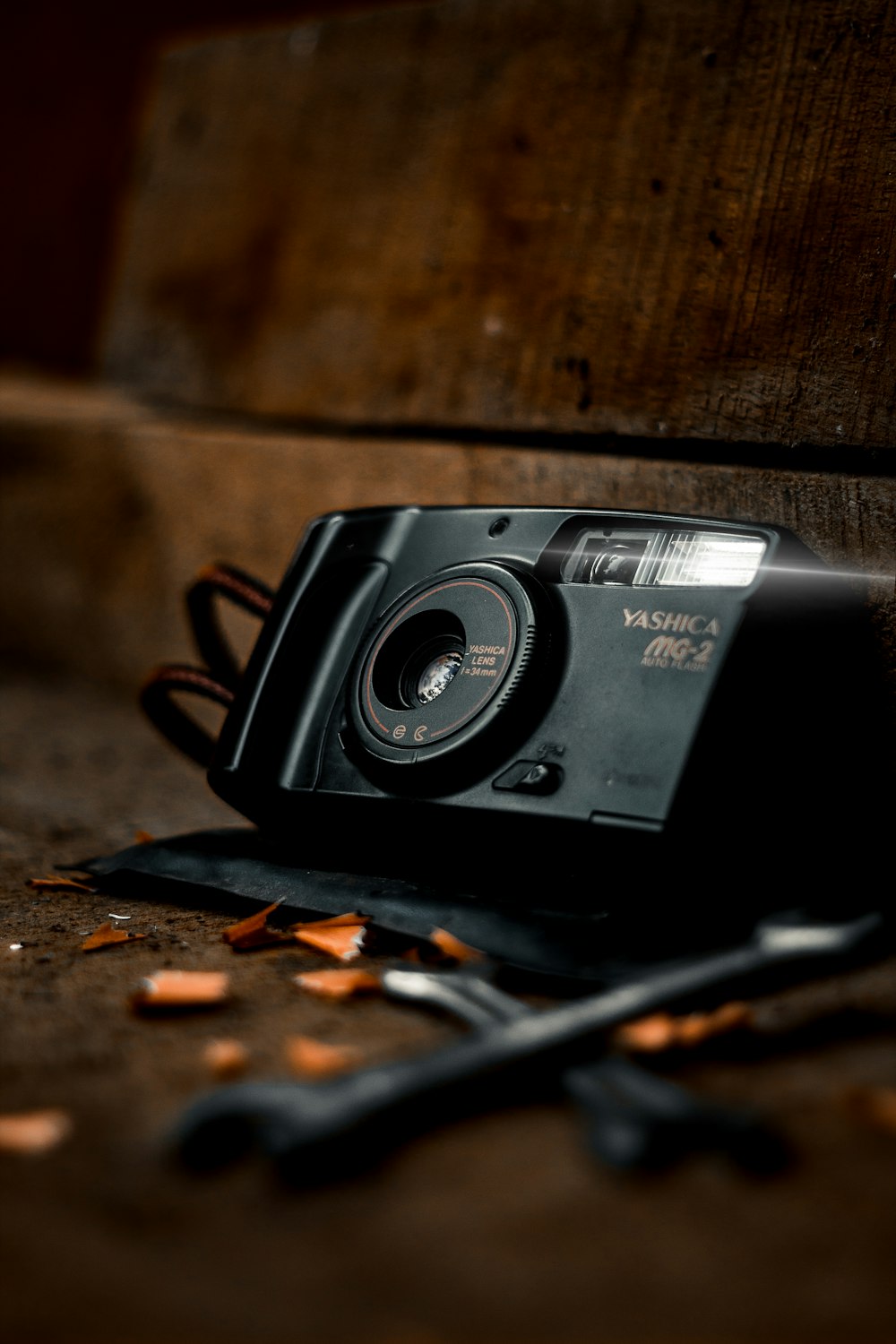 black and silver nikon camera on brown wooden table