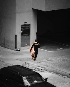 Courier delivering a package to a happy customer at their doorstep in a sunny neighborhood.