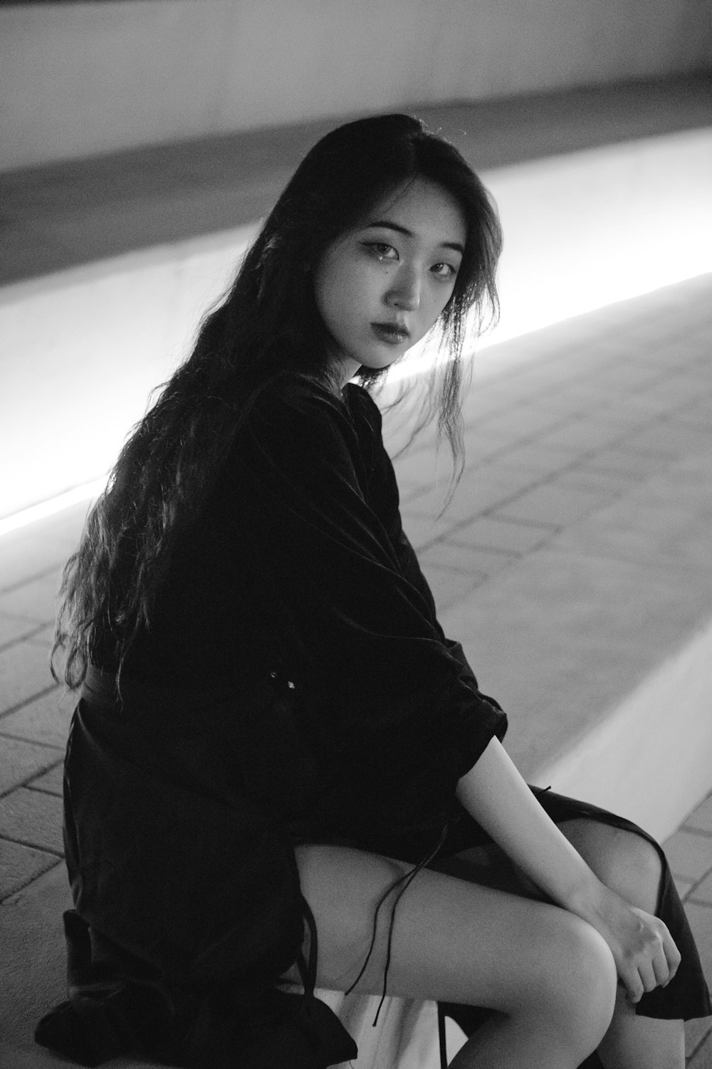 woman in black long sleeve shirt sitting on floor